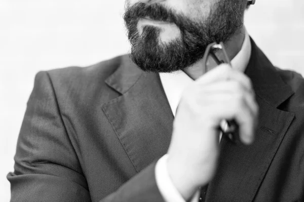 depositphotos_362323284-stock-photo-close-businessman-suit-tie-bearded